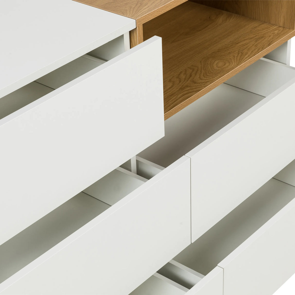 Geöffnete weiße Schubladen und ein offenes Fach in Eicheoptik des Sideboards MELMO S von hjh LIVING