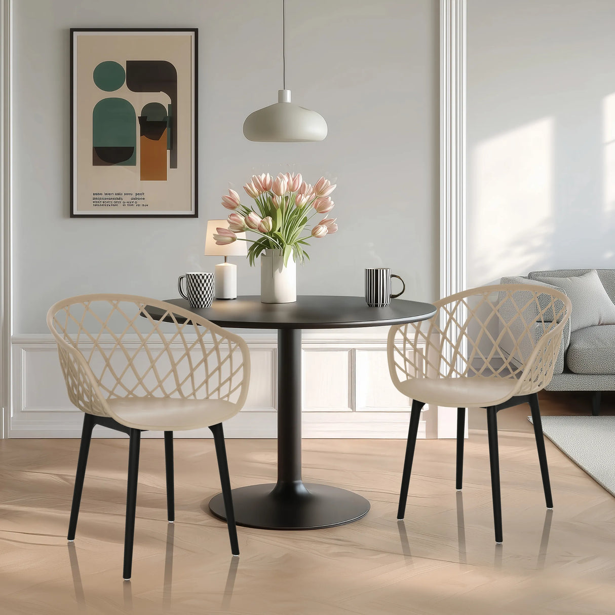 Zwei beige Schalenstühle BEGIO mit netzartiger Rückenlehne und schwarzen Beinen an einem runden Tisch von hjh OFFICE