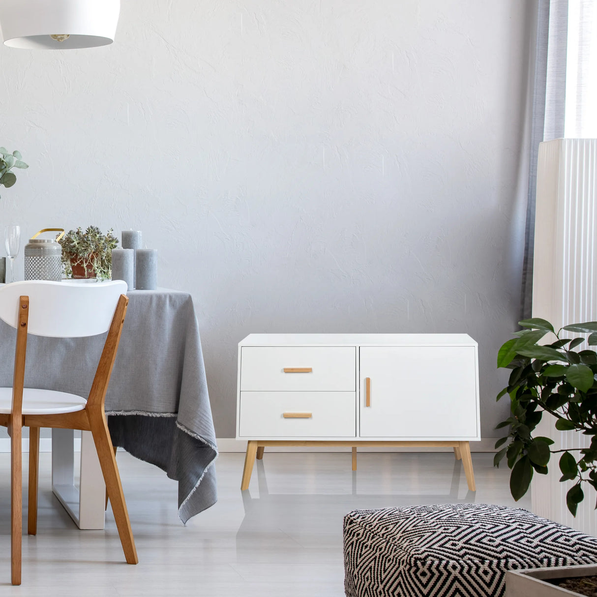 Weißes Sideboard TAROLO mit zwei Schubladen, einer Tür und hellen Holzbeinen von hjh LIVING