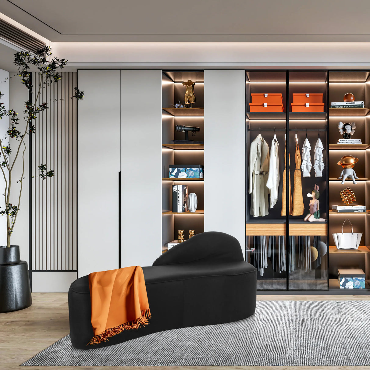 Schwarzes Loungesofa BARACOA mit einer orangefarbenen Decke vor einem Einbauschrank von hjh OFFICE