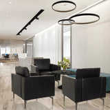 Drei schwarze Loungesessel BAVERO aus Kunstleder in einer modernen Büro-Lounge von hjh OFFICE