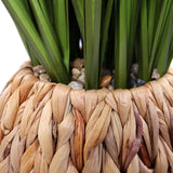Geflochtener Topf mit kleinen Steinen und grünen Blättern der Kunstpflanze CORTADERIA von hjh OFFICE