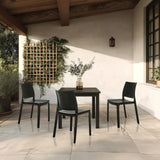 Drei schwarze Outdoor-Stühle T37 V mit passendem Tisch auf einer Terrasse von hjh LIVING