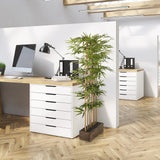 Grüne Kunstpflanze BAMBUS I in einem dunklen Holzgefäß für das Büro von hjh OFFICE
