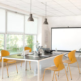 Gelber Vierfußstuhl T36 VI mit schmalen Beinen in einem hellen Konferenzraum von hjh OFFICE